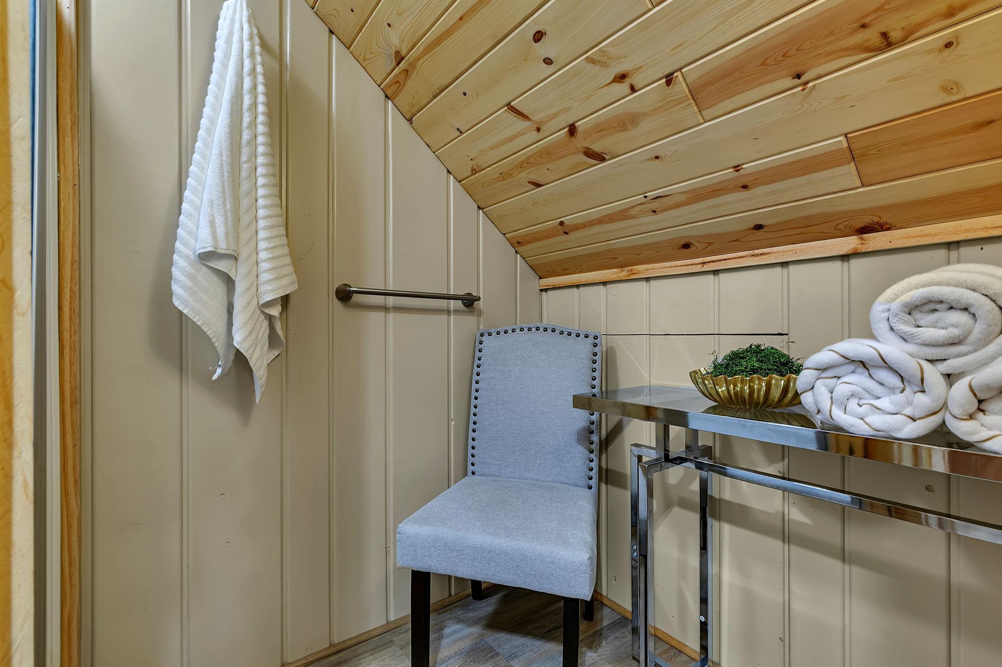 This room features the shower and is a convenient changing room and/or makeup room!