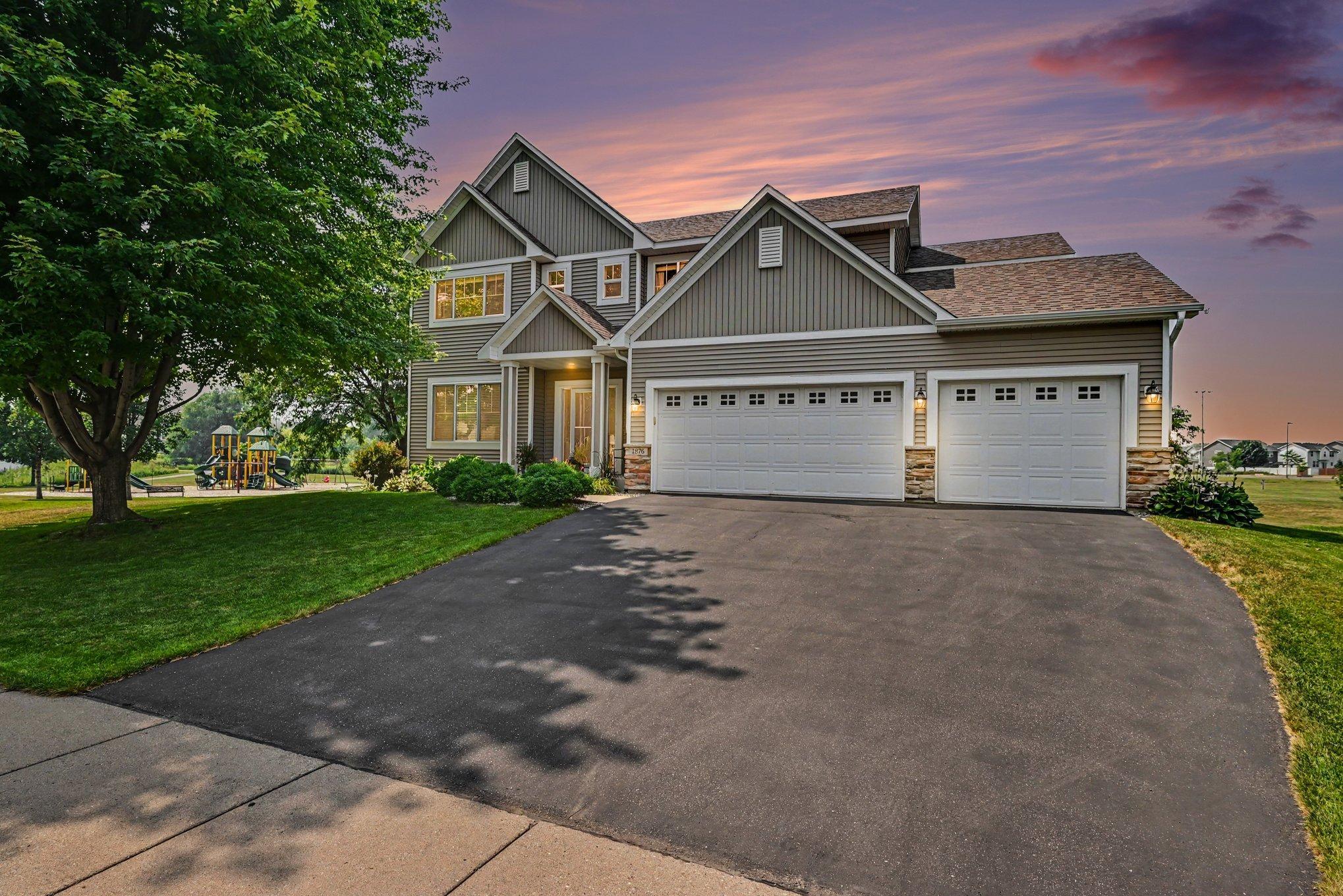 Twilight view of 1876 Foothill Trail, a 5-bedroom home in Shakopee, MN