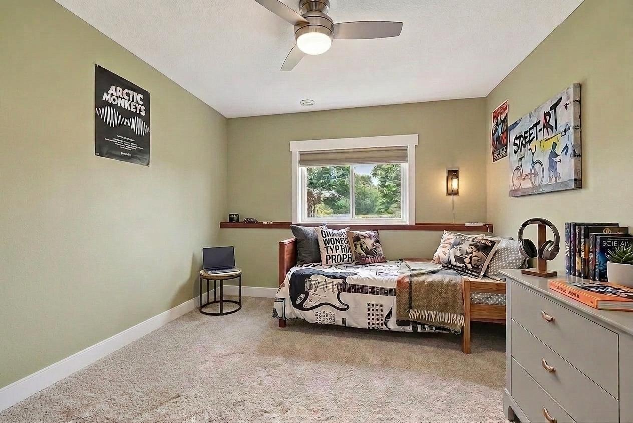 5th bedroom on the lower level (virtually staged to show potential layout)