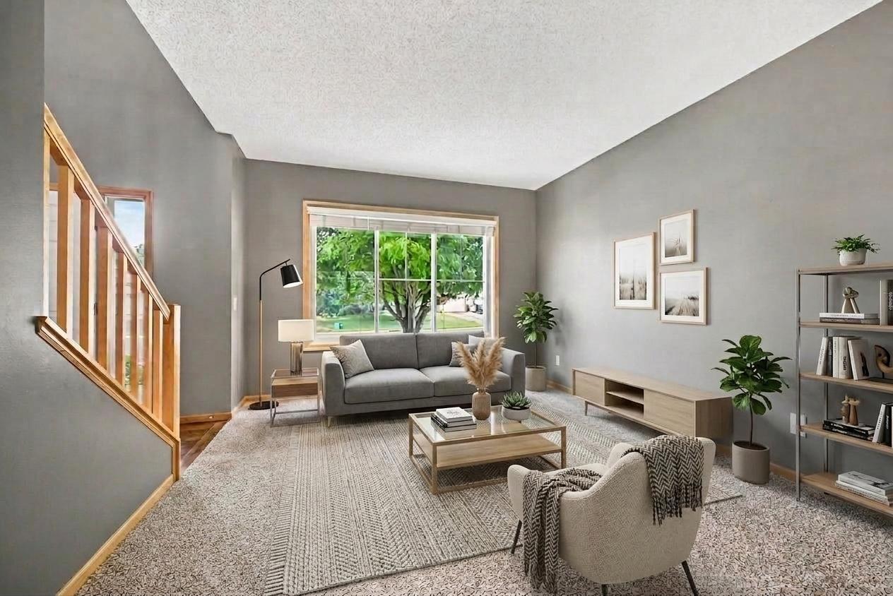 Main-level living room, virtually staged to show layout potential