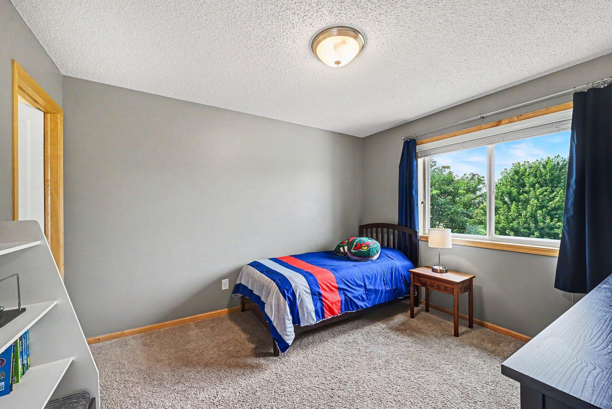 Upper-level bedroom with natural light Bedroom 4