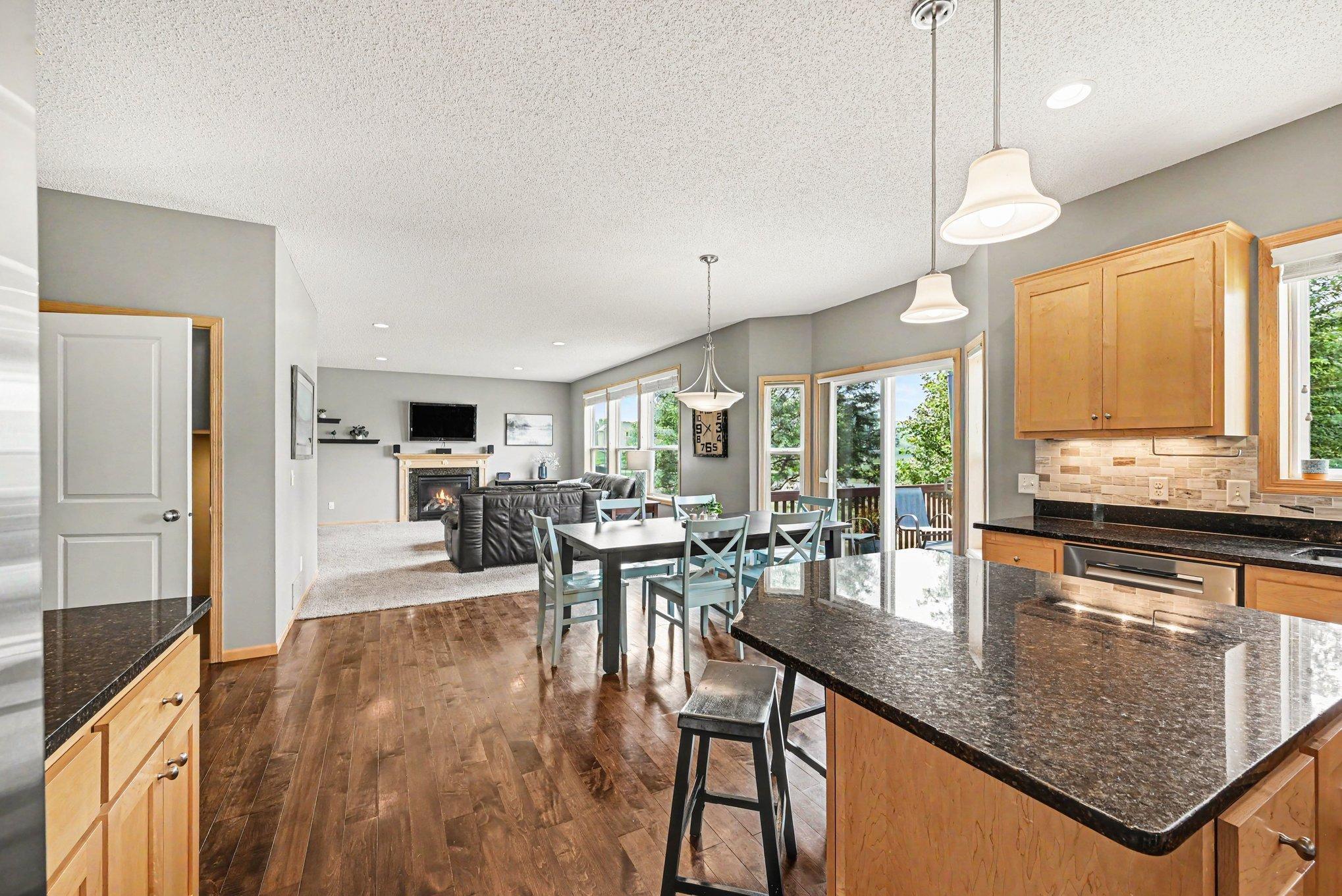 Open-concept kitchen flowing into the family room