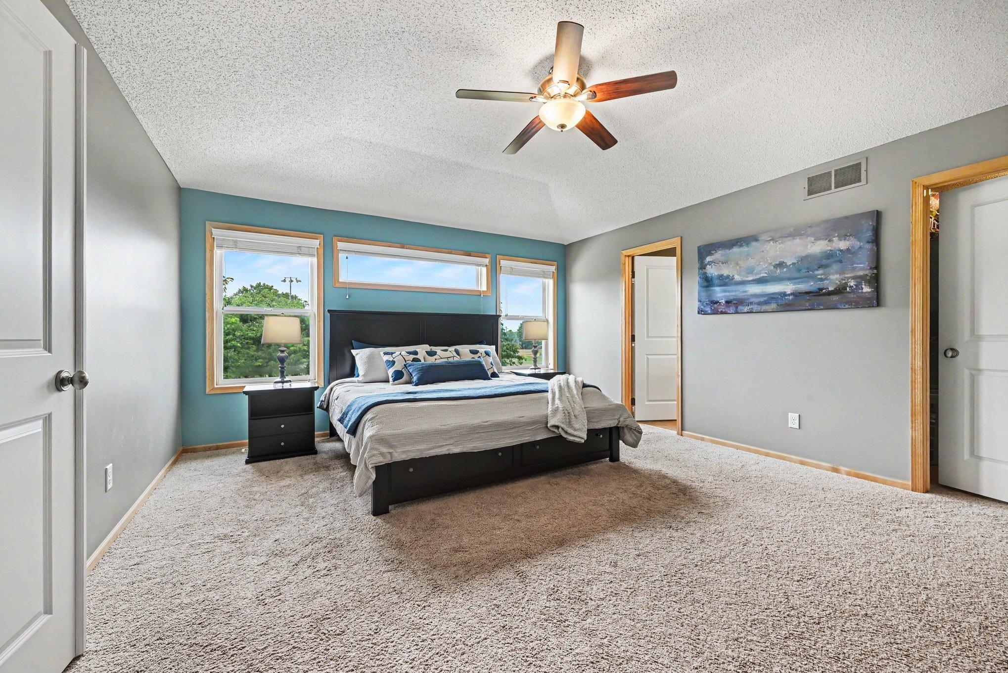 Primary bedroom with room for a sitting area