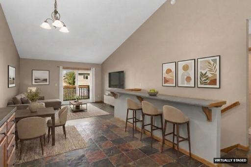 Vaulted ceilings & open kitchen/dining/living room floorplan