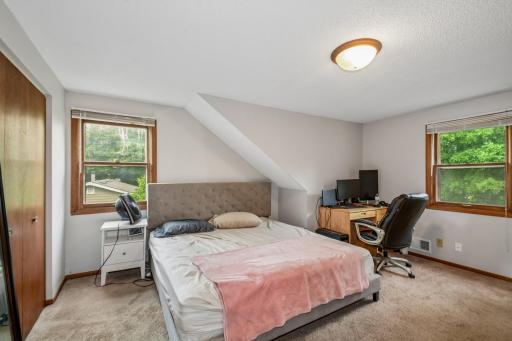 Upstairs primary bedroom with ensuite bathroom.