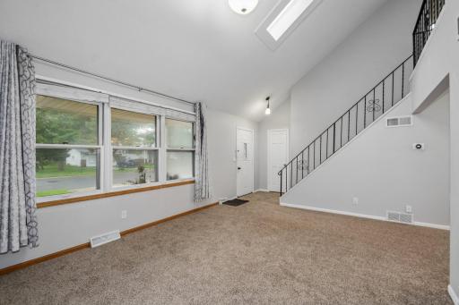 Living room, showing the front door and the front windows.