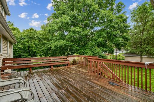 Large deck with built-in seating along one side.
