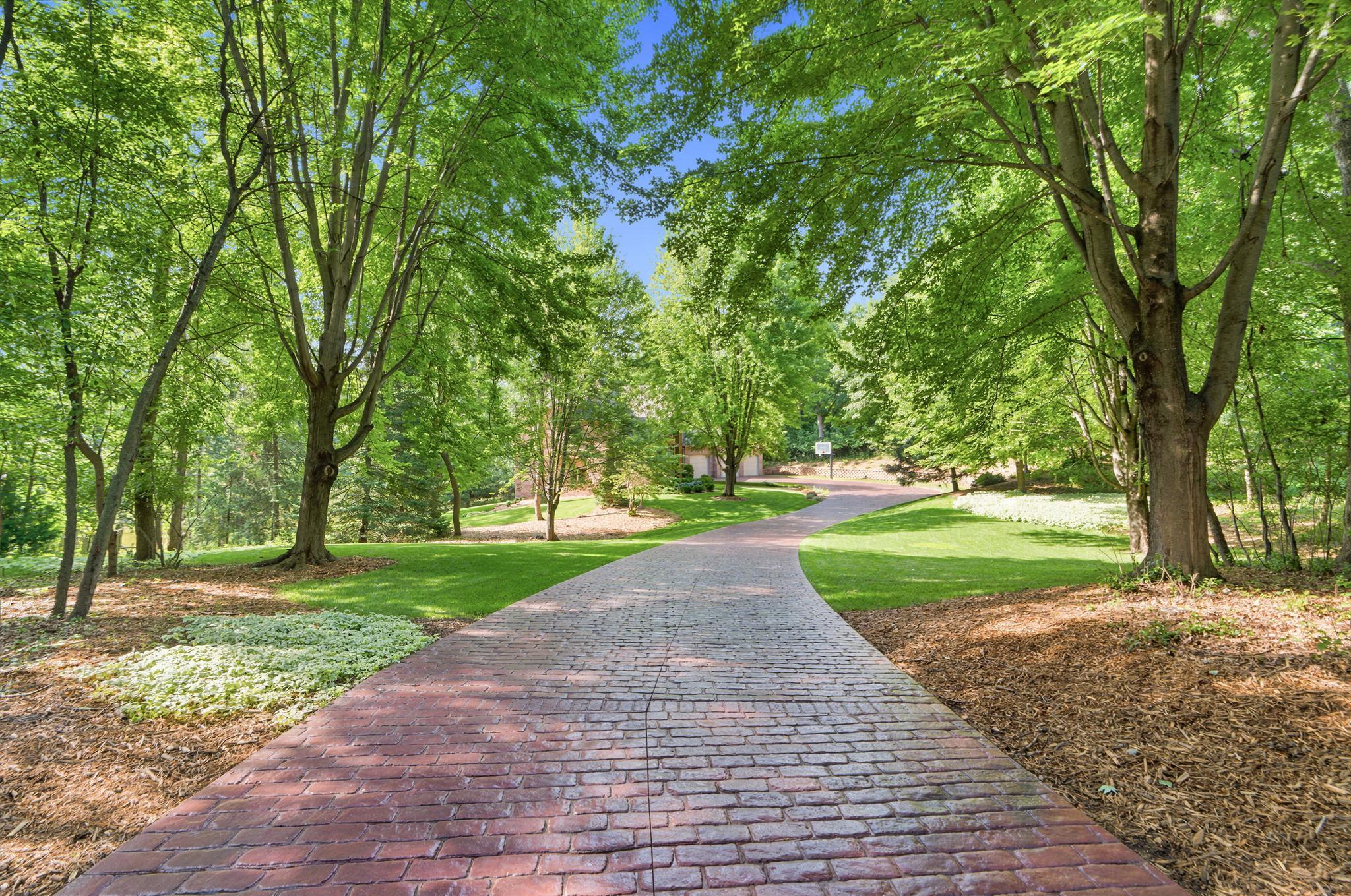 Winding, stamped concrete driveway.