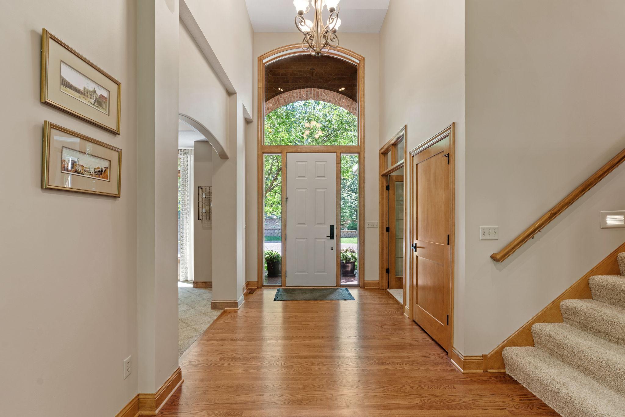 Vaulted foyer and entrance to office.