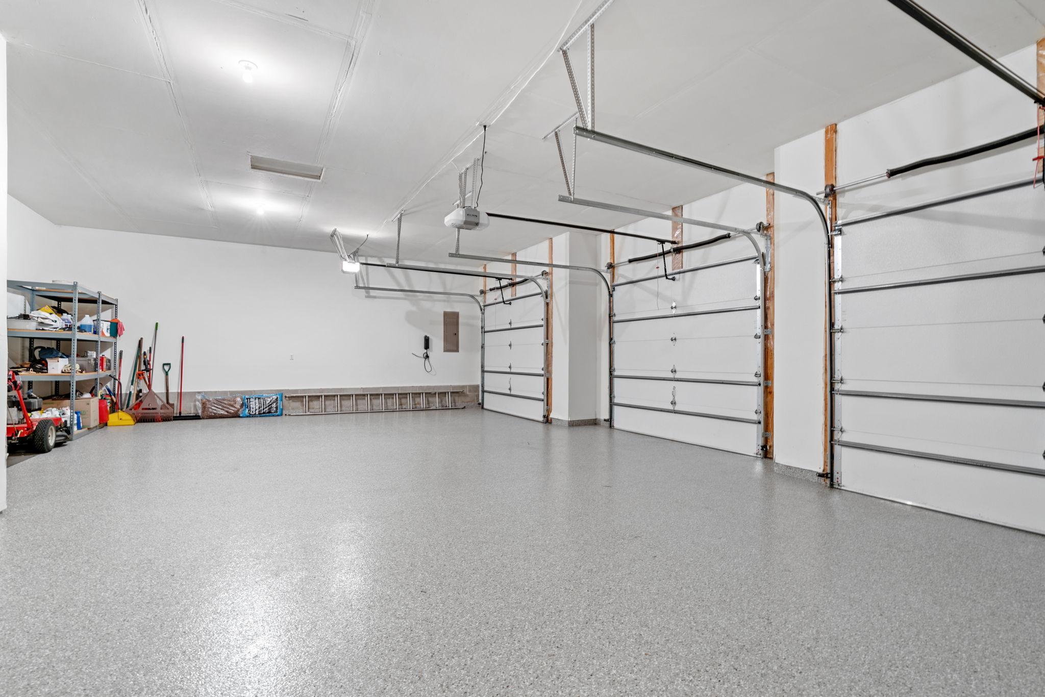 Newly epoxied, oversized three stall garage.