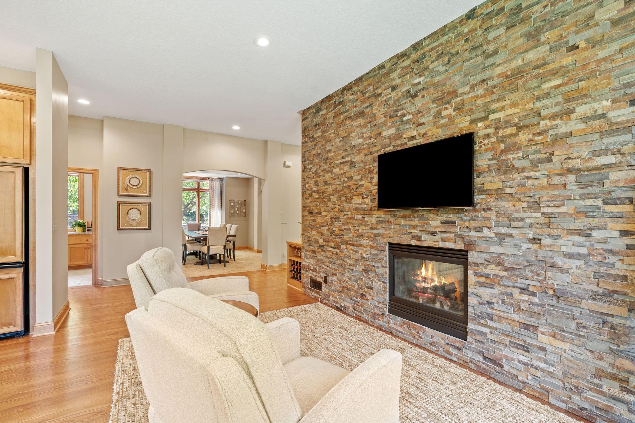 Dual sided fireplace with stone feature wall.