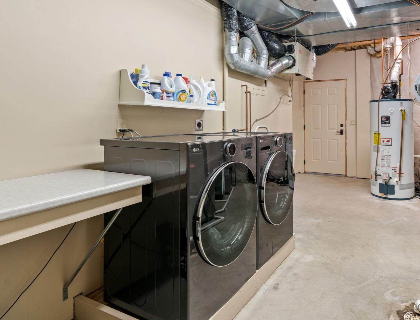 Lower level laundry, utilities and secondary entrance to garage.