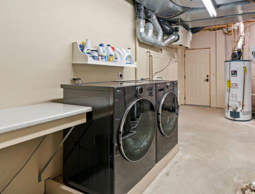 Lower level laundry, utilities and secondary entrance to garage.