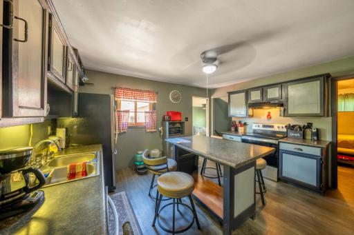 Large eat in kitchen with new luxury vinyl plank flooring!
