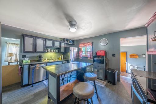 Stainless steel appliances, moveable center island with bar stools, moveable double door pantry, and microwave and stand all included!