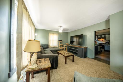 Large living room with brand new carpet and coat double door coat closet!