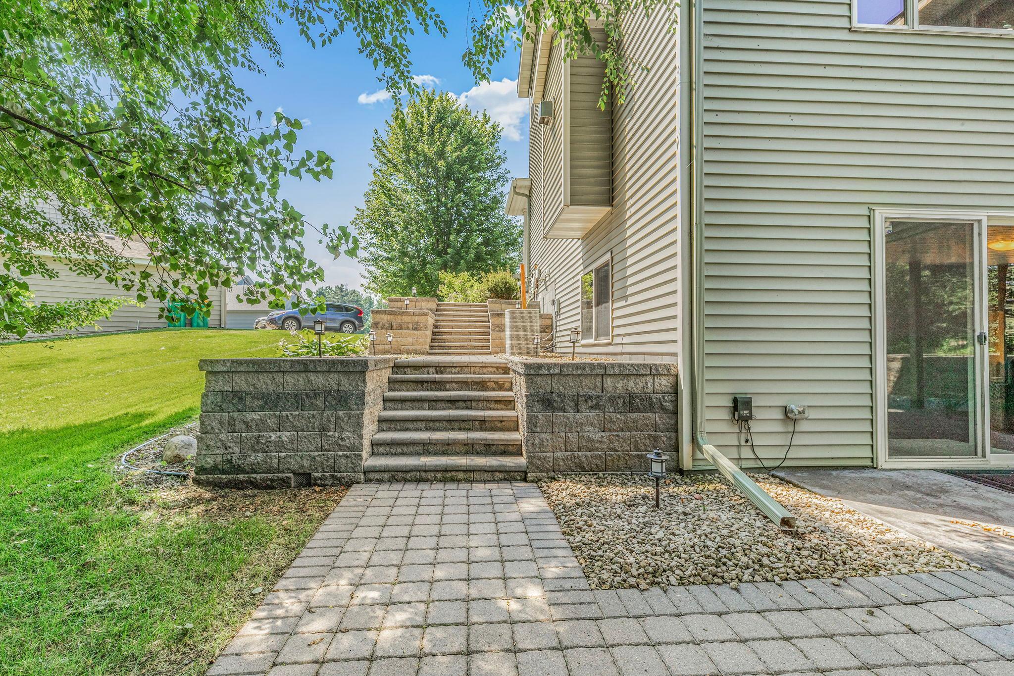 Professionally designed and landscaped with retaining walls and paver pathways