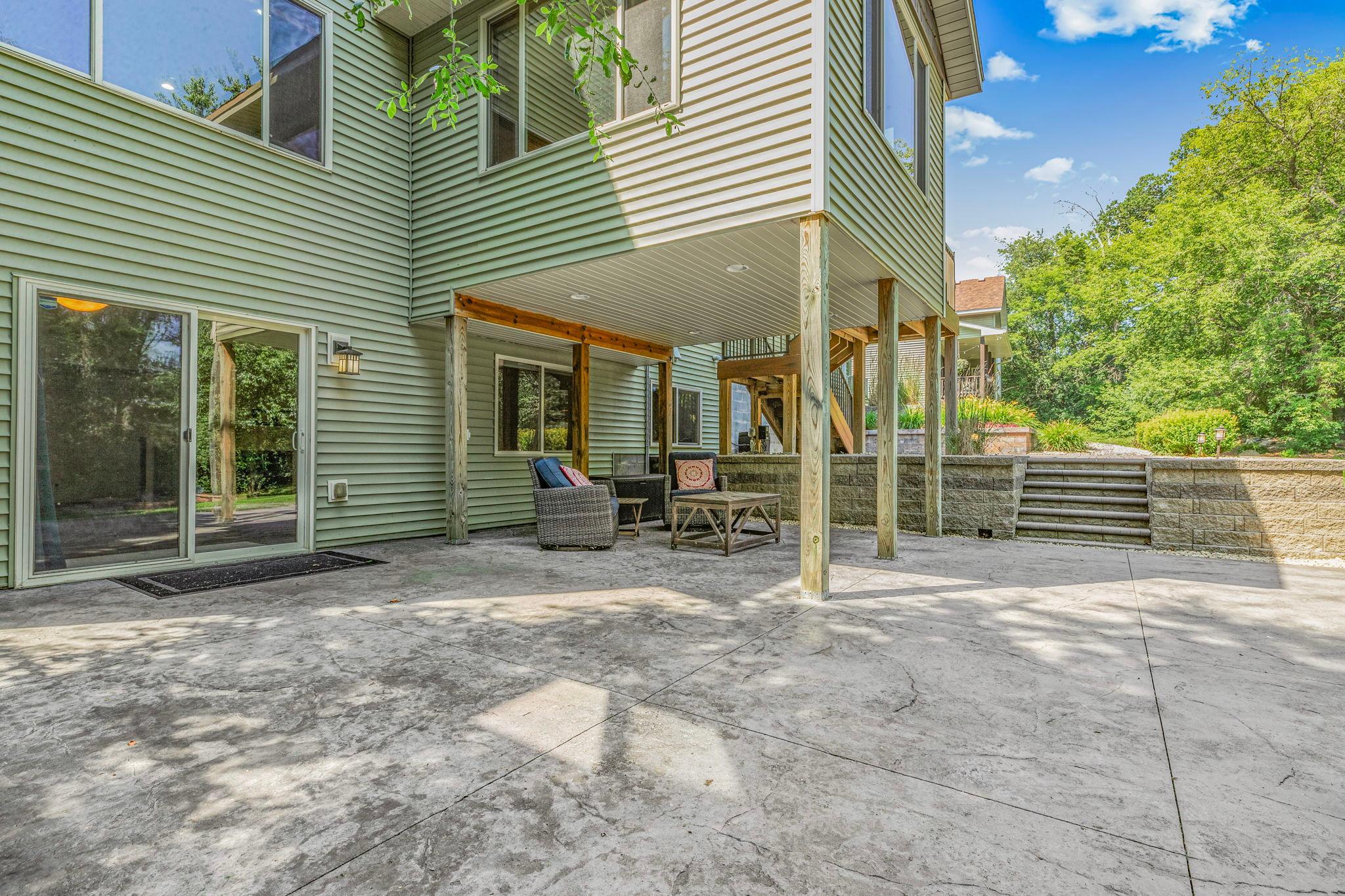 Expansive outdoor living area with stamped concrete finish
