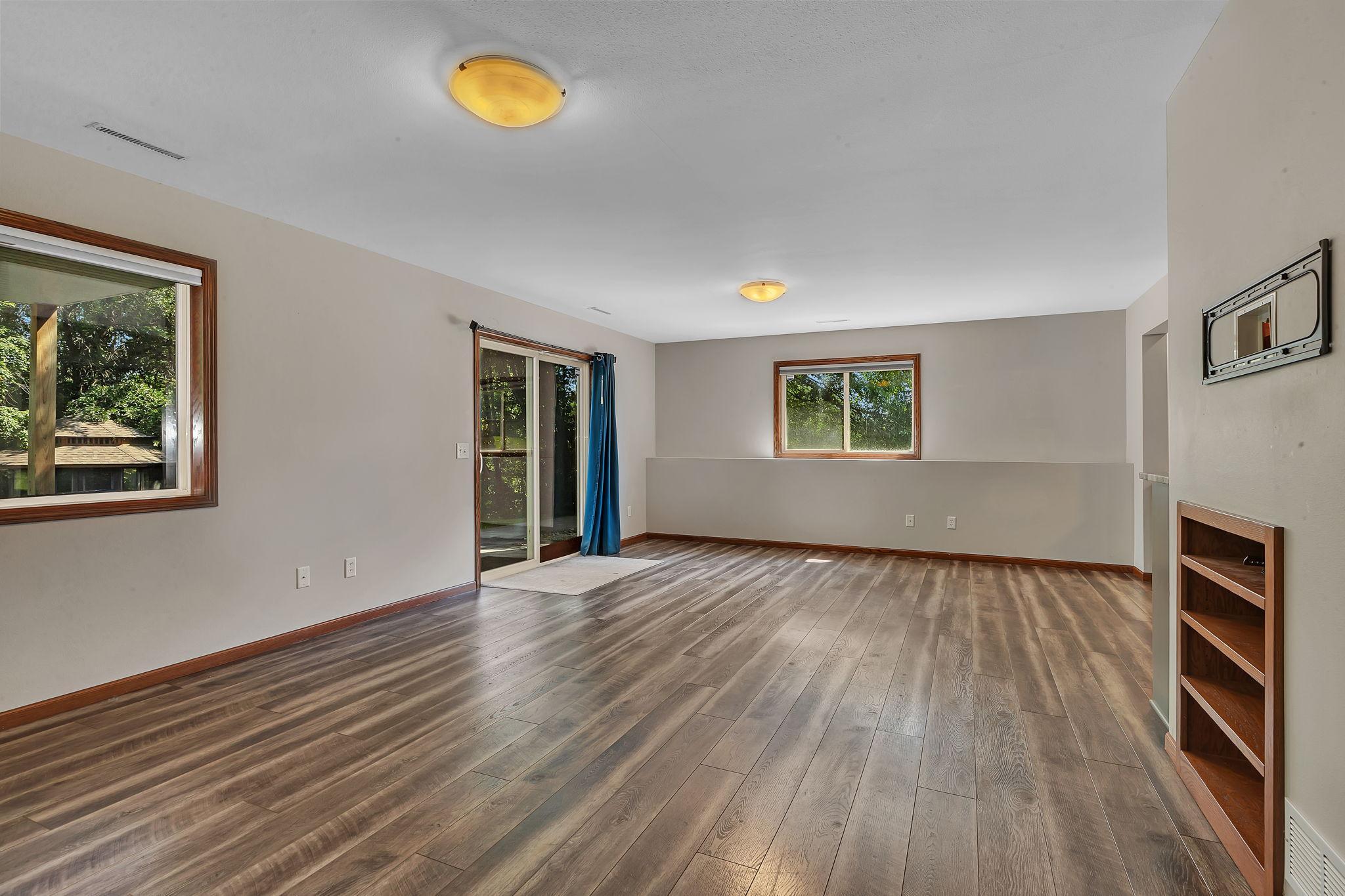 Large open family room in lower level that walks out to private backyard