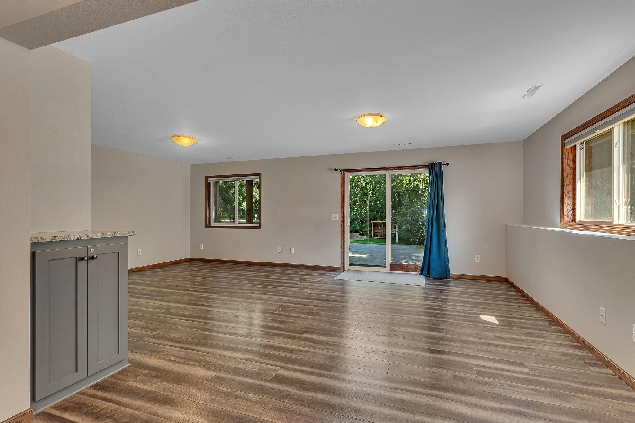 Spacious family room is perfect for entertaining, relaxing with a movie or creating a play area.