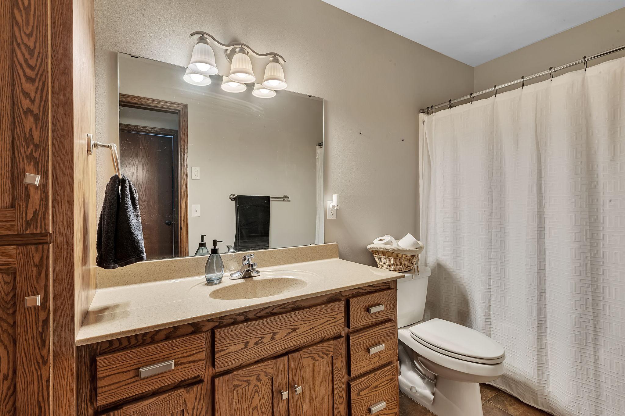 Full bathroom located in the lower level