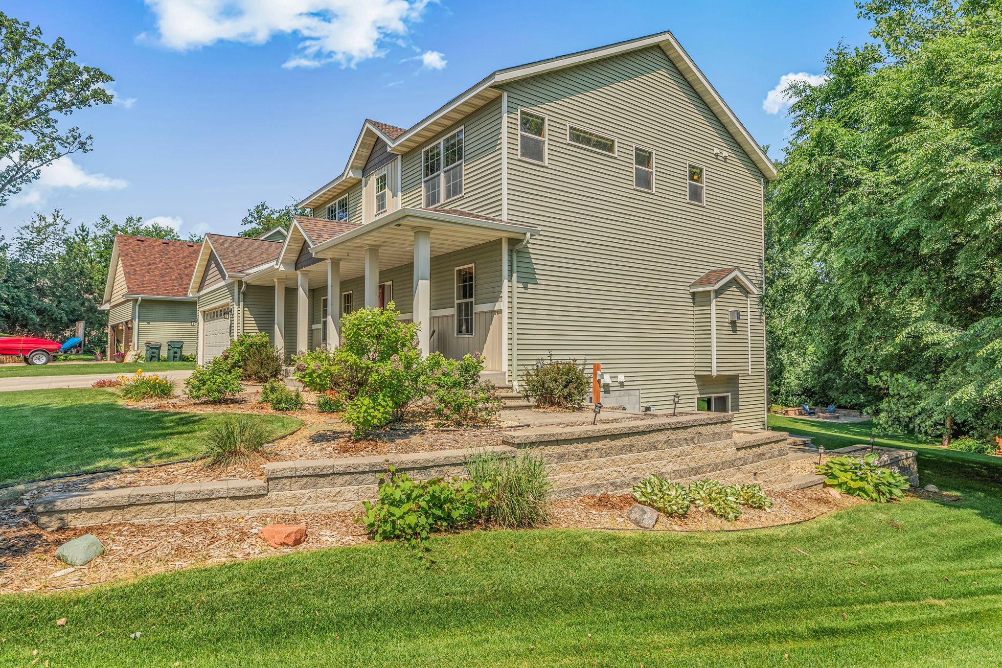 The home is finished with extensive landscaping and retaining walls