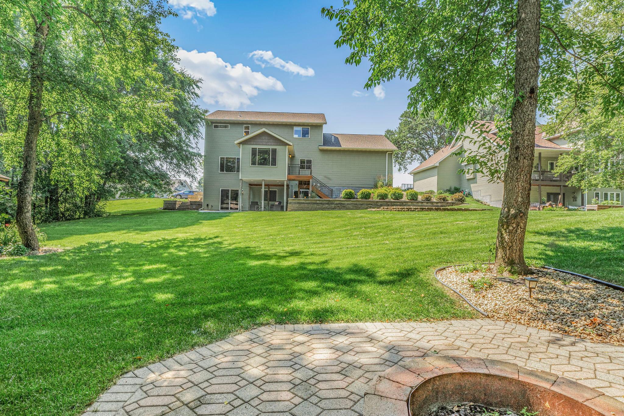 Nestled in a large private wooded lot just under an acre