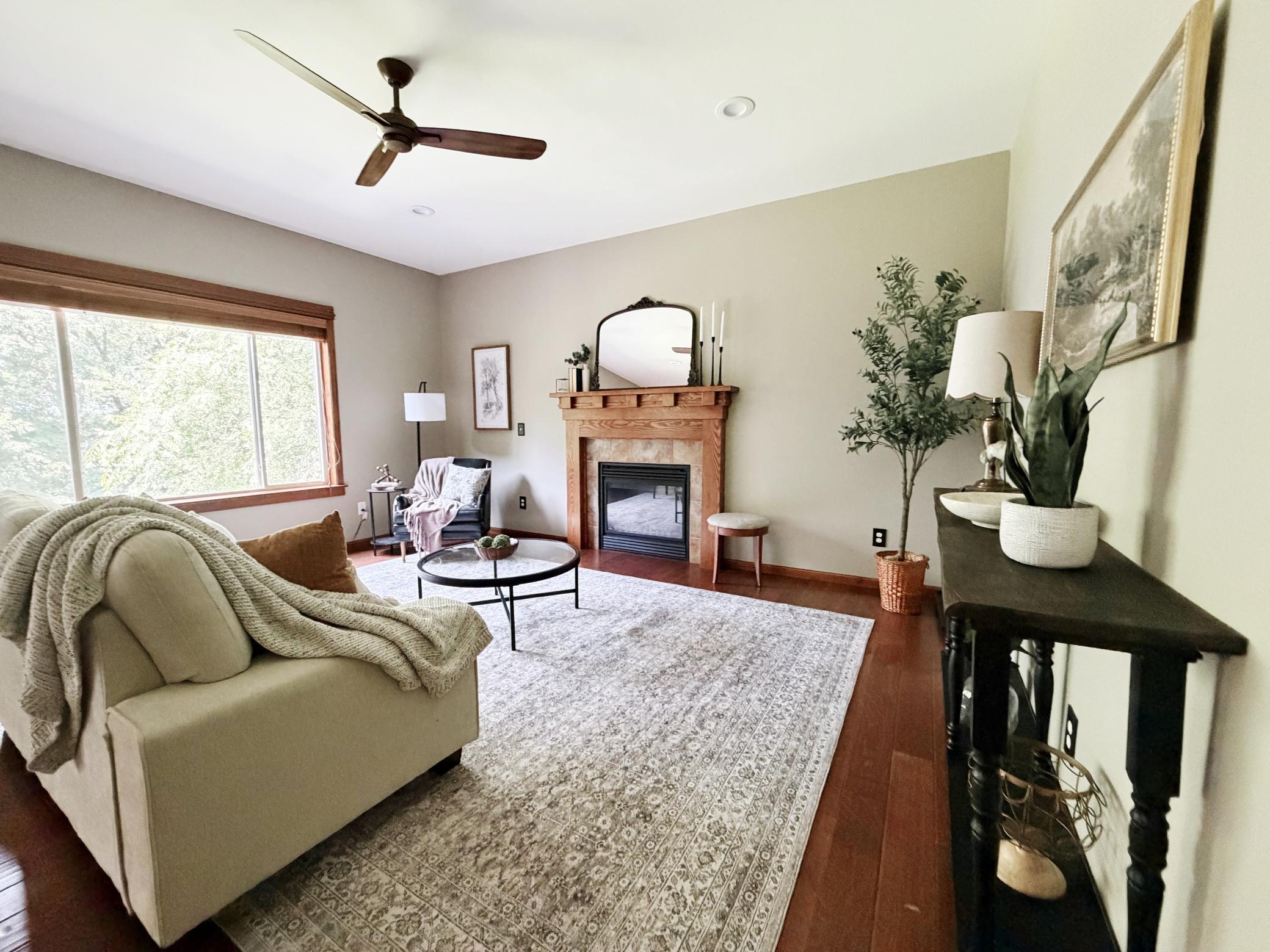 Inviting living room highlighted by a cozy fireplace.