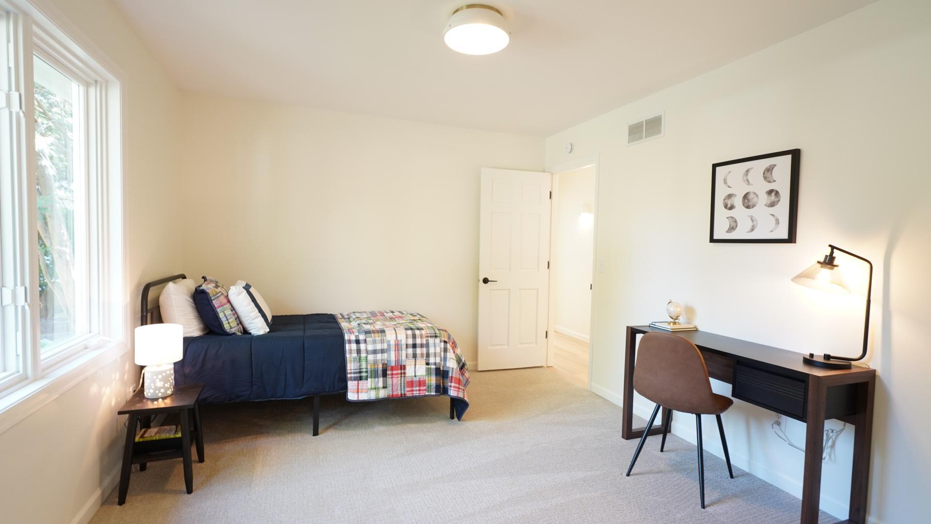 Bedroom 4 features large windows and ample space for furniture.