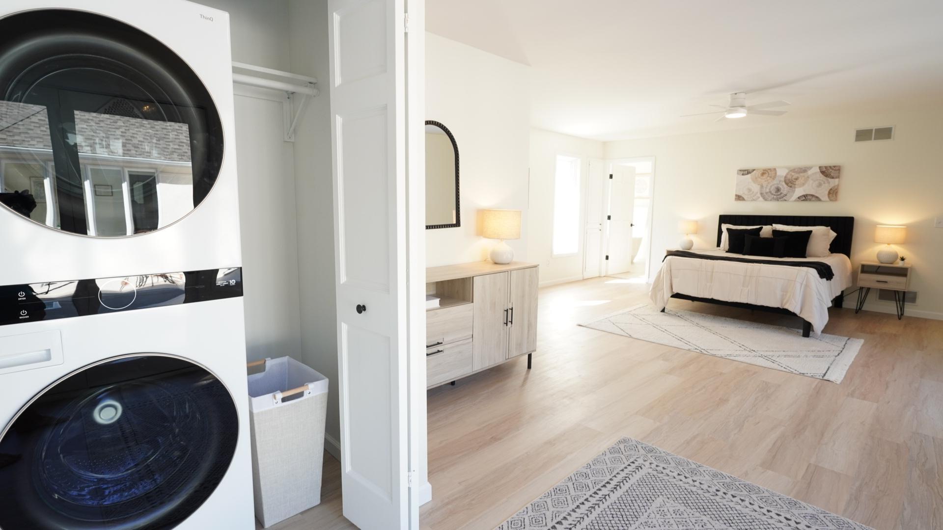 The generous primary suite includes a full sized, brand new wash tower and ample room for a seating area or furniture.