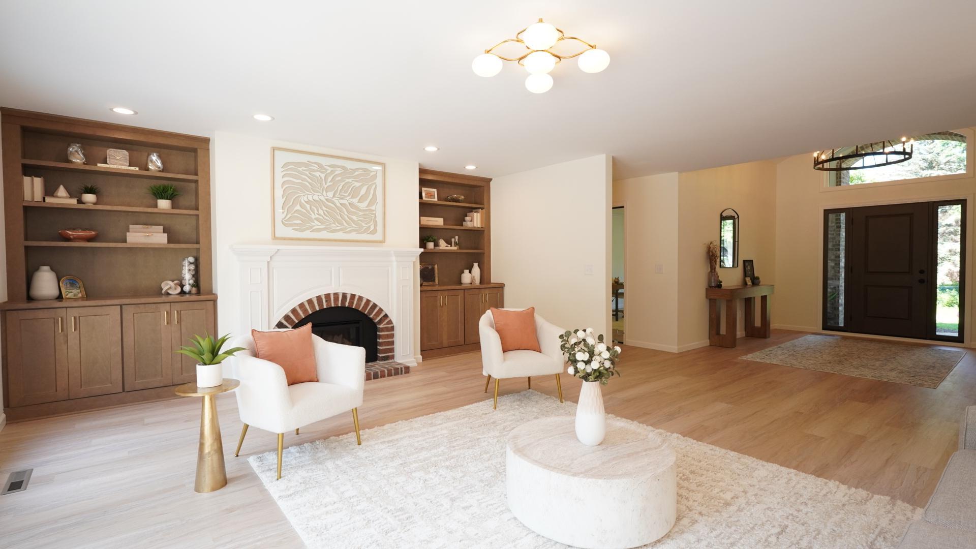 The open central living room connects the back yard with the vaulted front foyer and grand entry.