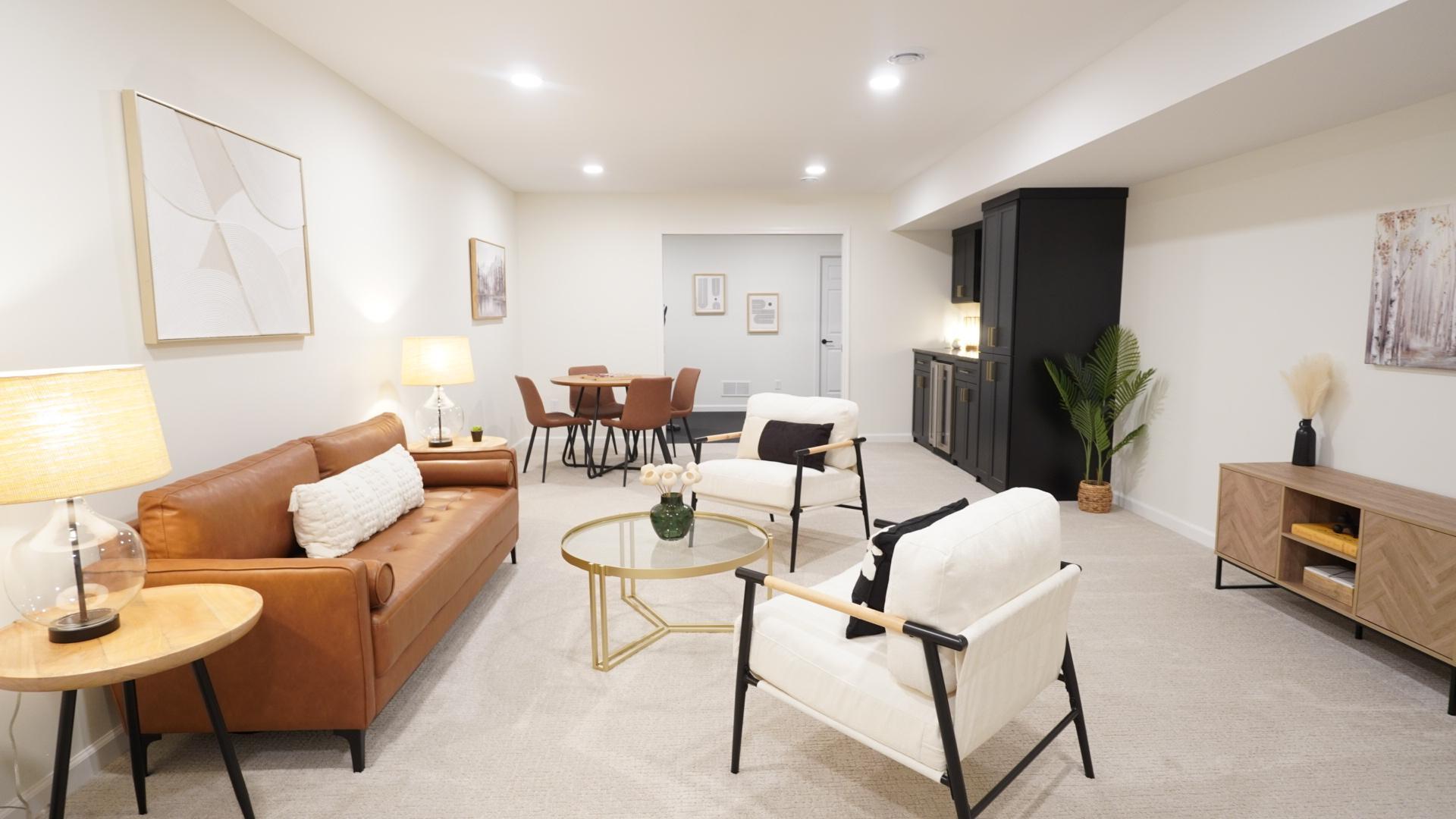 The newly finished family room added approximately 1000 square feet to the house's total, and is the perfect place for watching movies, family game night, or exercising in the newly added workout room.