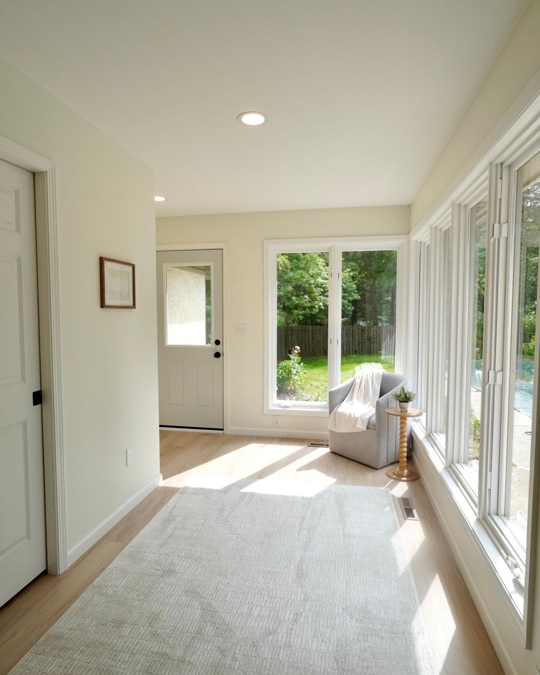The sunroom, directly behind the eat-in kitchen with easy access to the pool, is filled with natural light and boasts the newly added Bathroom 3/ pool changing area behind the pocket door.