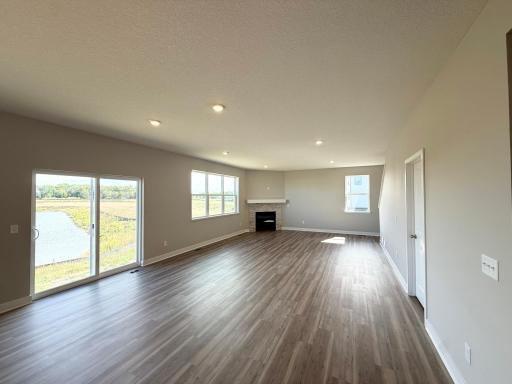 Picture of the Actual Home: Large open concept main floor main centered around the beautiful gas fireplace.