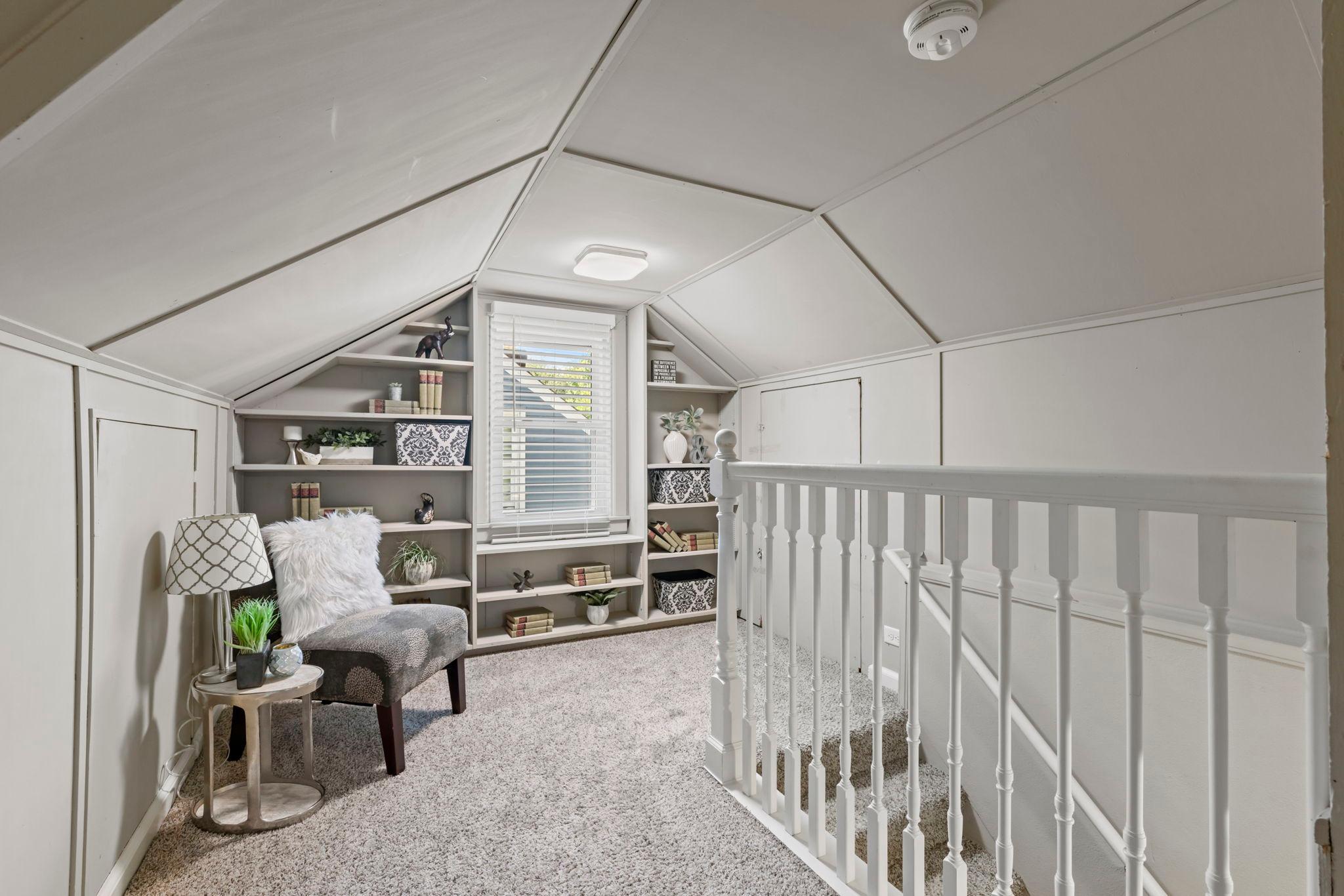 Upper half story is perfect for an owner's suite and office nook!