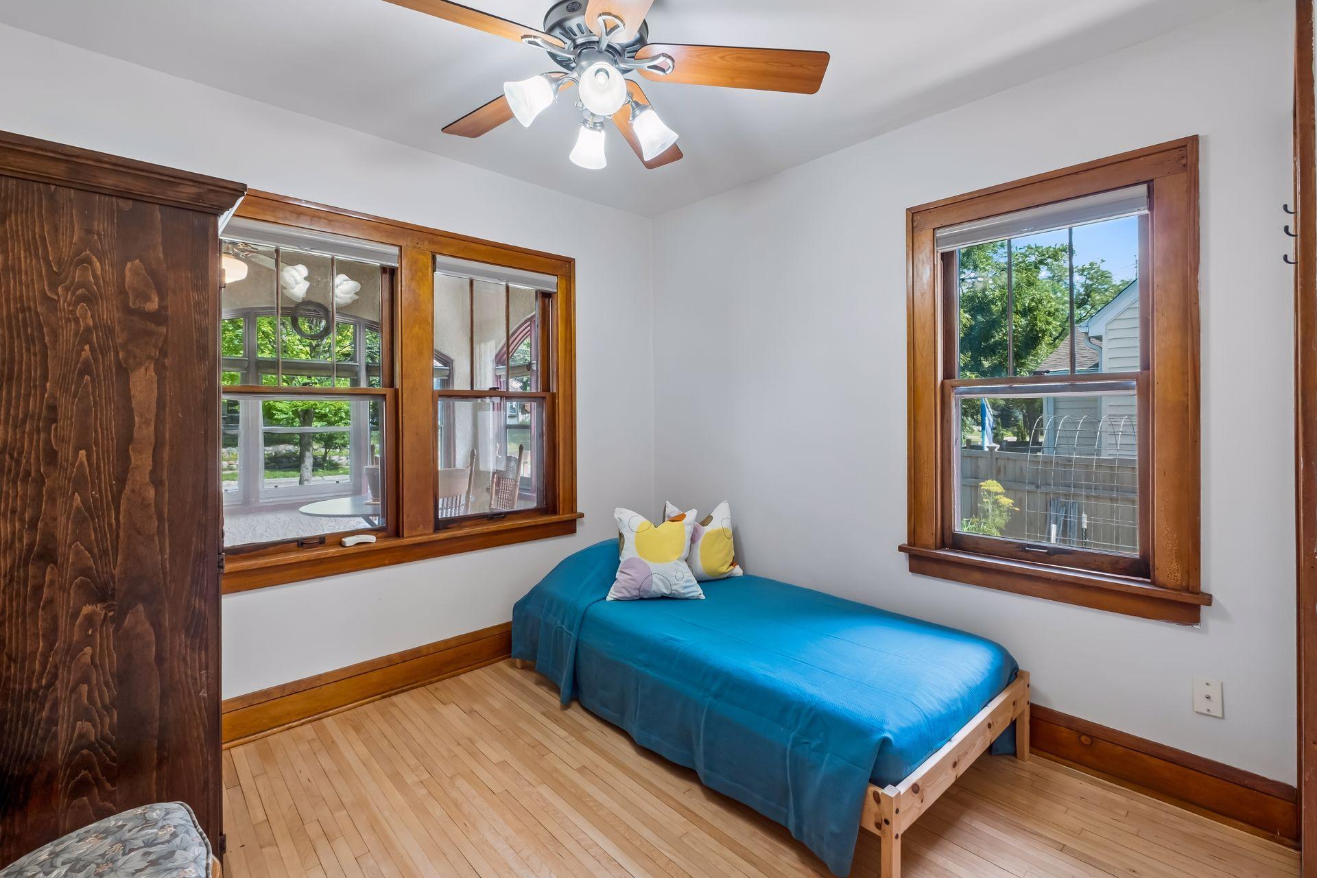Main floor bedroom with newly refinished hardwood floors.