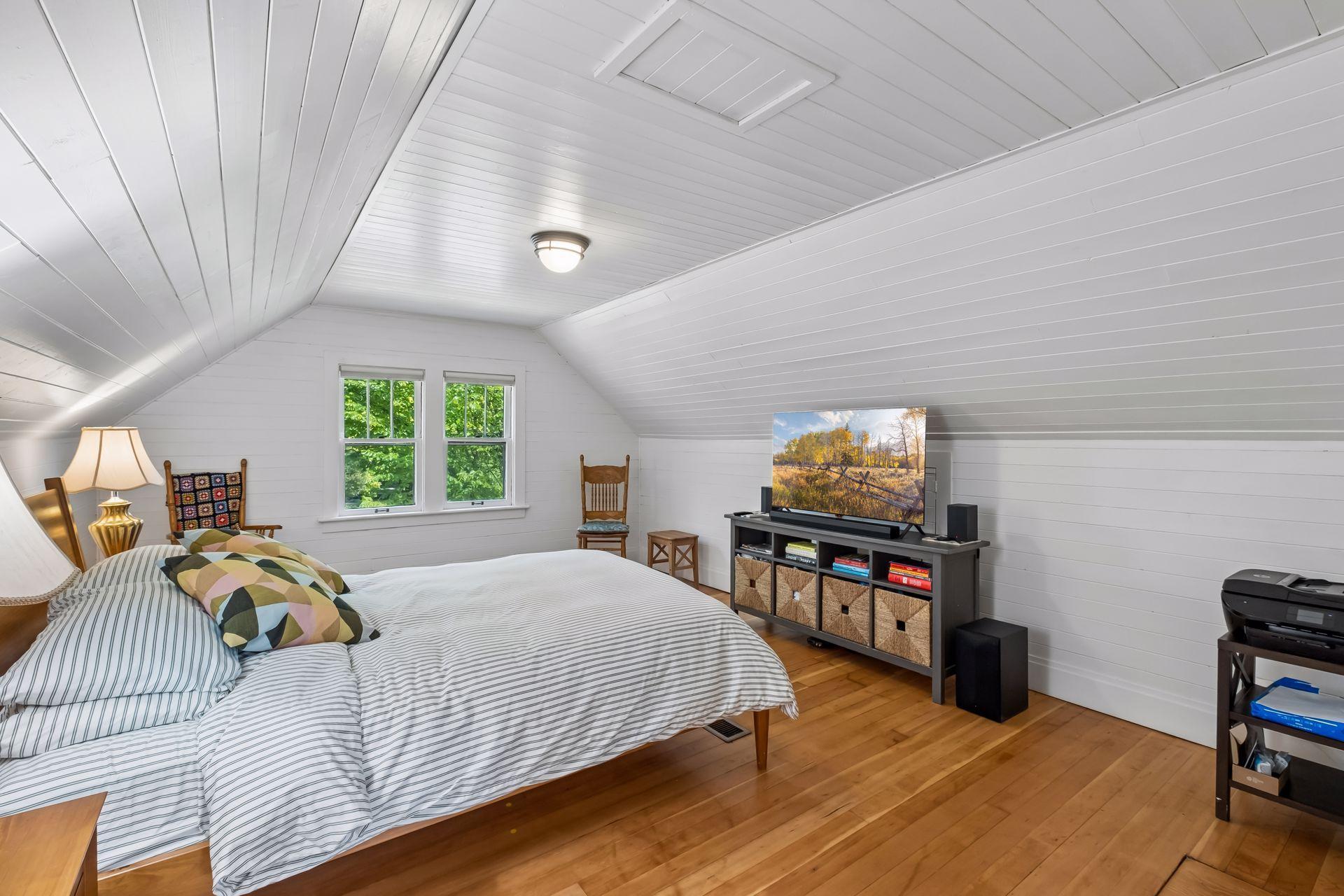 The bedroom and sitting room have gleaming hardwood floors.