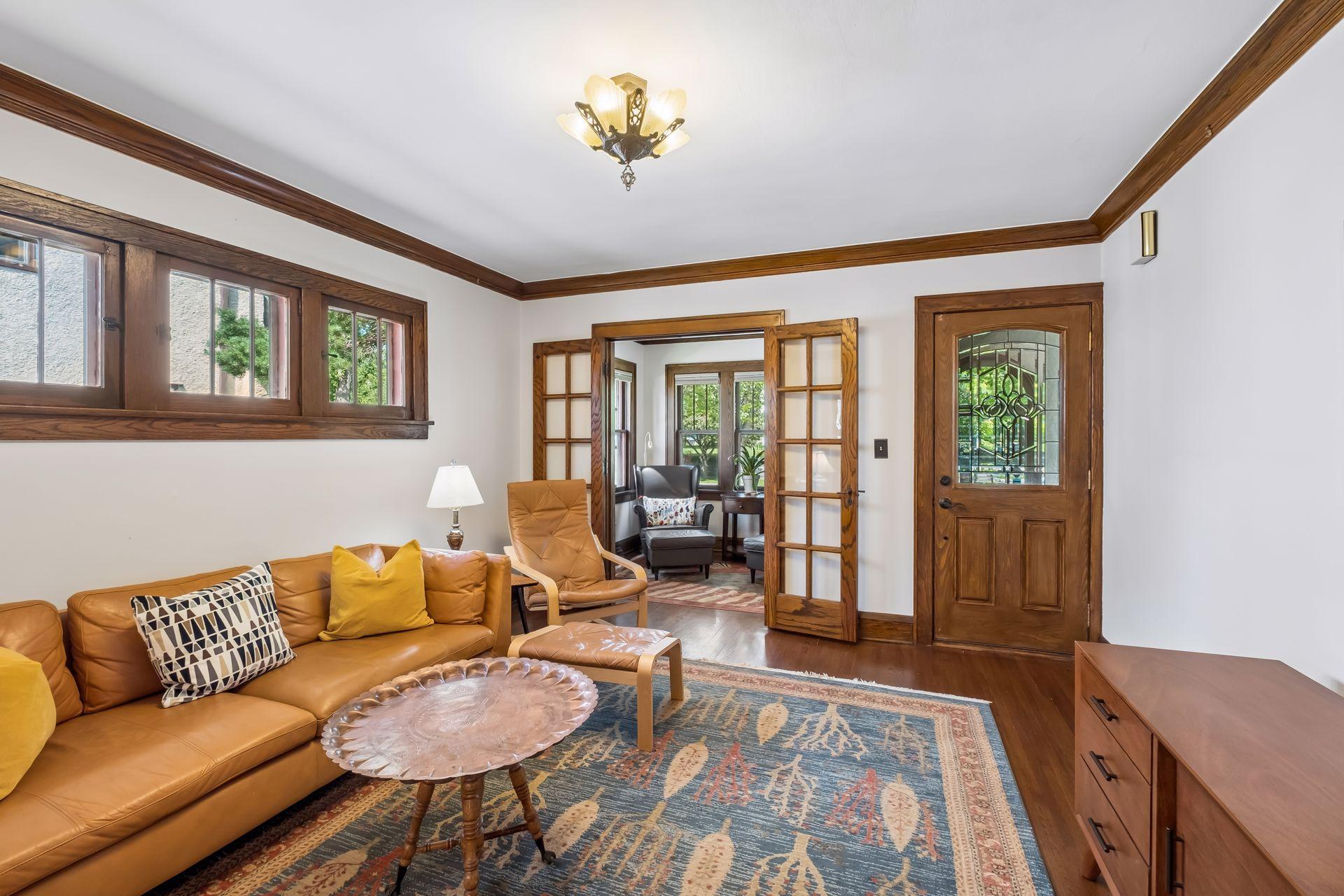 The living room features French doors to a lovely front sun room.