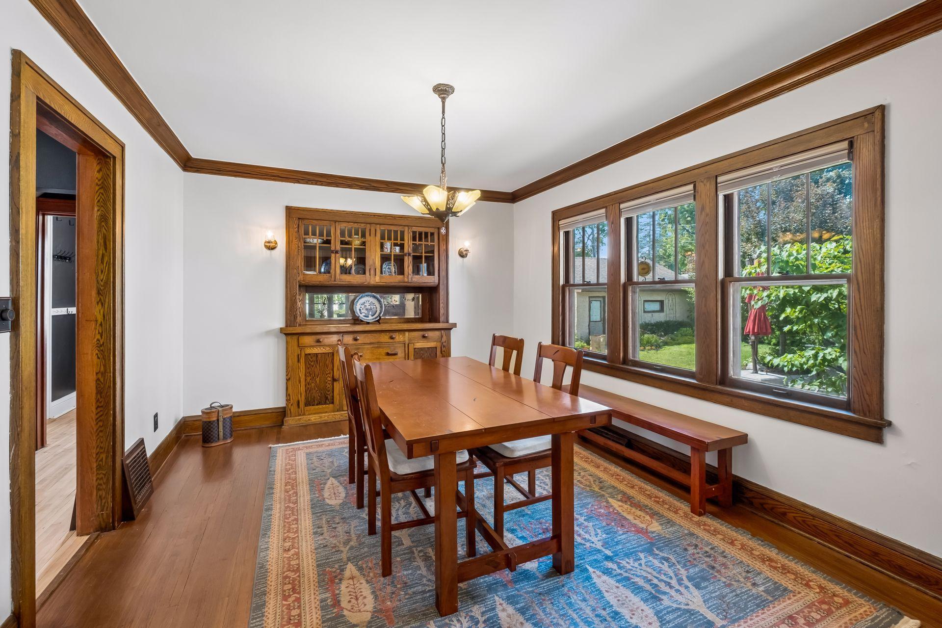 Separate formal dining room with gorgeous built-in buffet, crown molding, and hardwood floors. The windows offer top/down bottom up blinds.