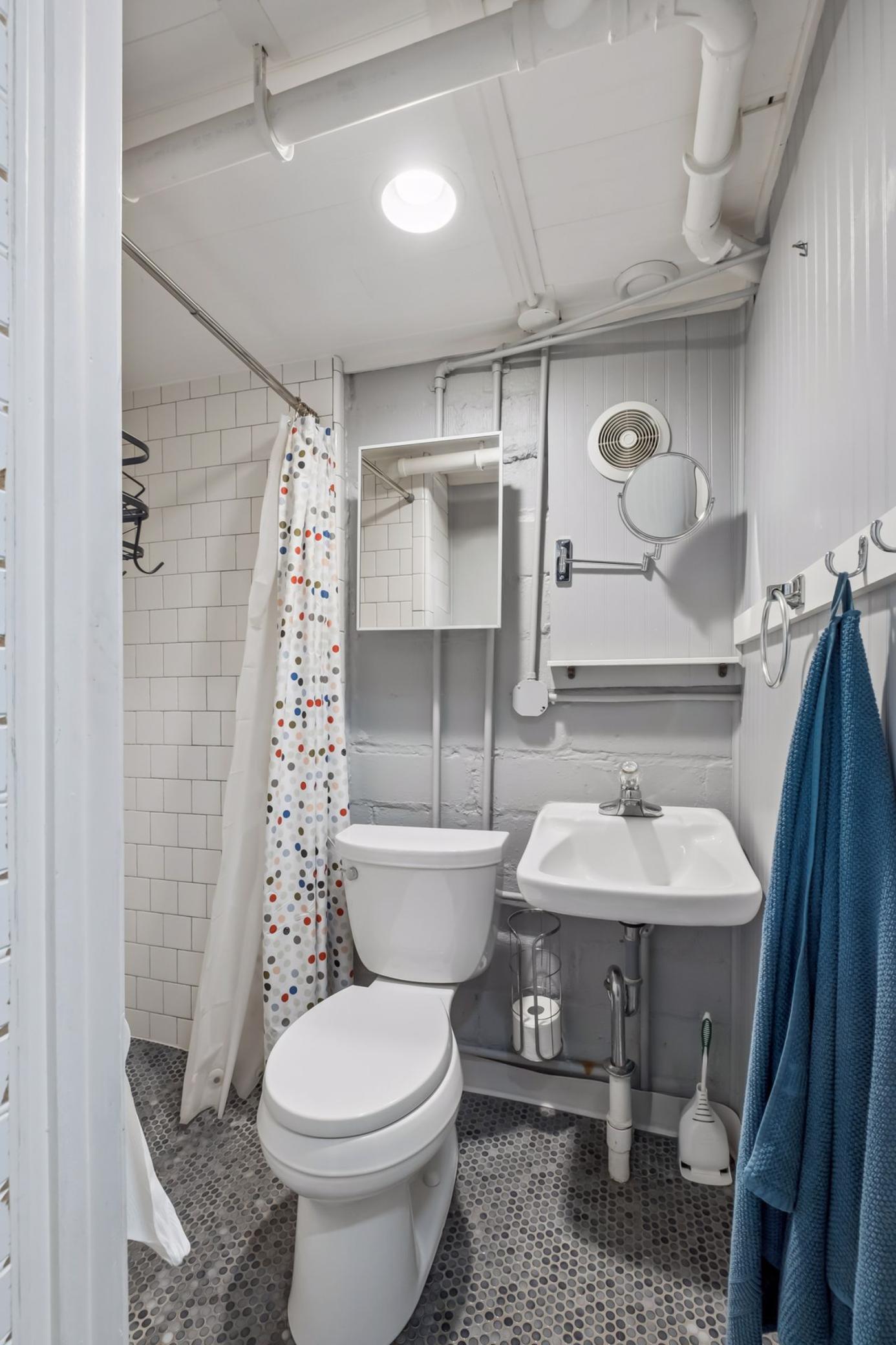Lower level 3/4 bath with tiled walk-in shower.