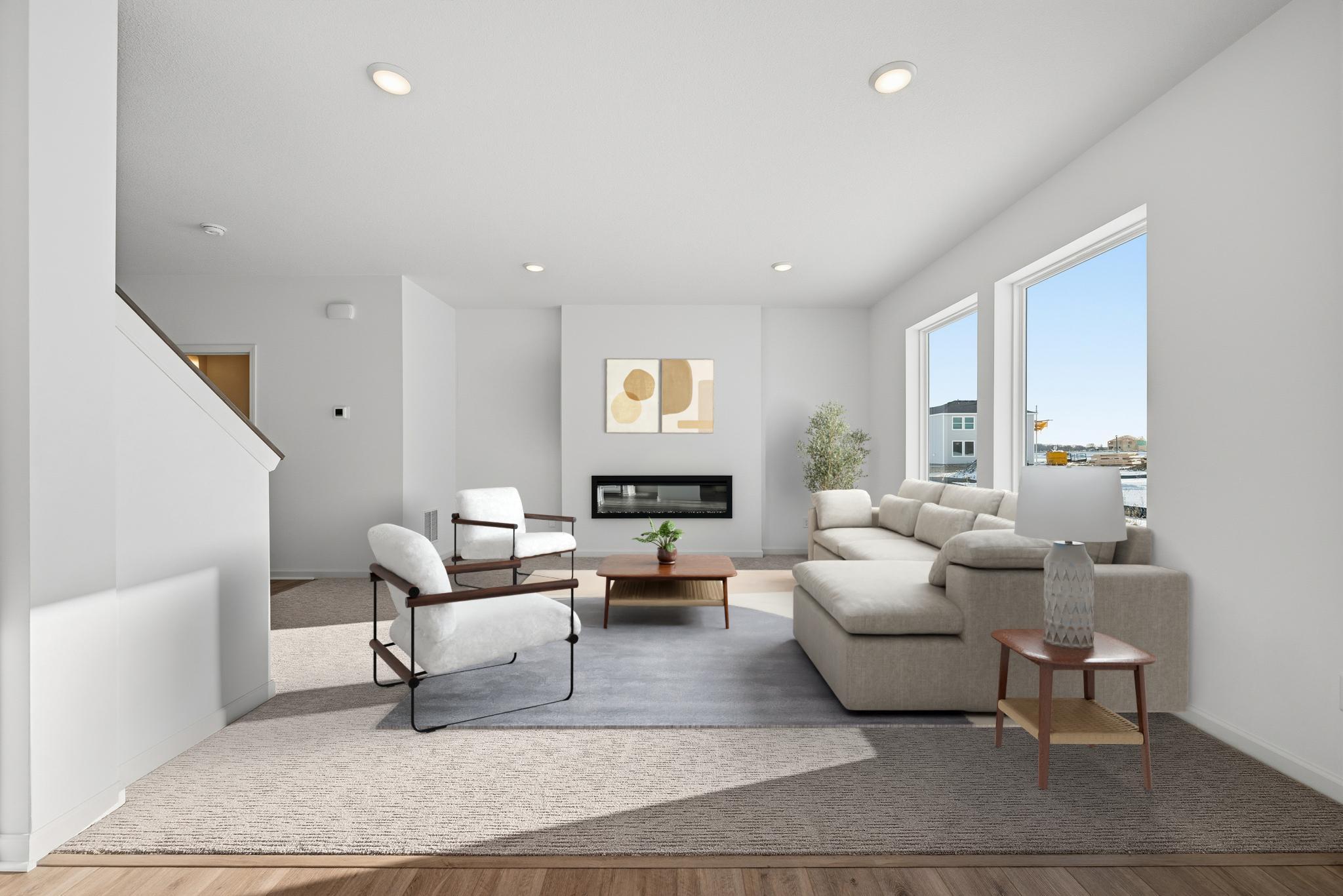 Welcome to the Elias - The main living space is bright and welcoming, featuring large windows that bring in abundant natural light. **Virtual staged** - Images of similar home, interior selections differ.