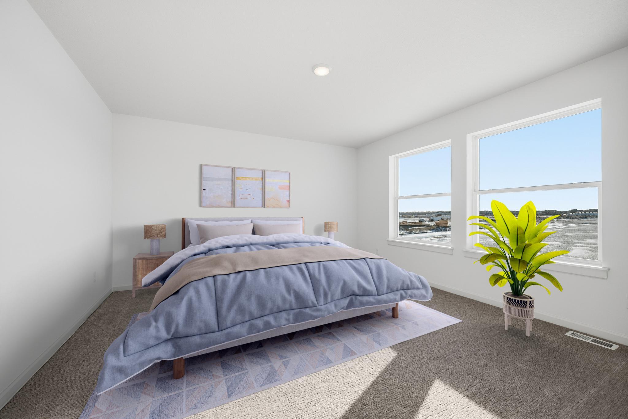 The primary bedroom serves as a comfortable retreat with generous space and large windows that fill the room with natural light. *Virtual staged* Images of similar home, interior selections differ.