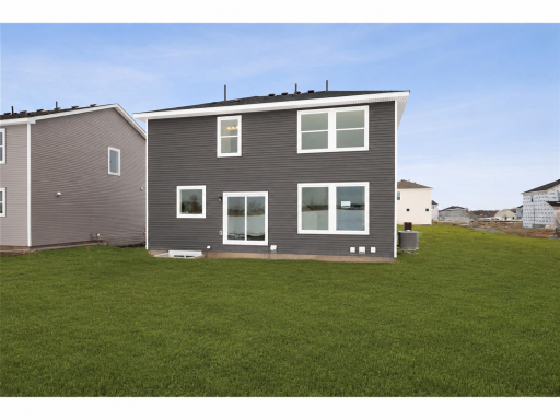 The exterior presents a clean, modern design with complementary siding, crisp trim, and an attached two-car garage for everyday convenience. Images of similar home, selections differ.