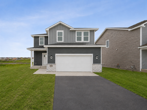 The exterior presents a clean, modern design with complementary siding, crisp trim, and an attached two-car garage for everyday convenience. Images of similar home, selections differ.
