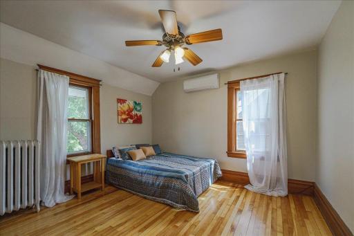 Upstairs bedroom one is spacious with beautiful floors