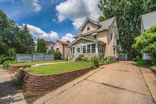 Sizeable driveway and retaining wall leading to the garage