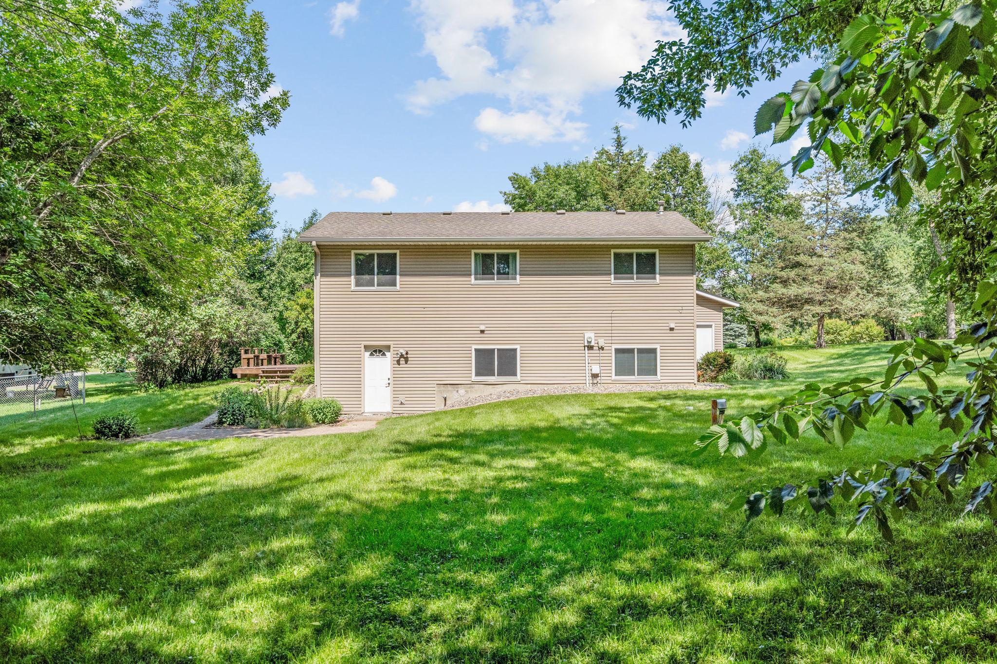 House is situated on over an acre with a wooded area in the back
