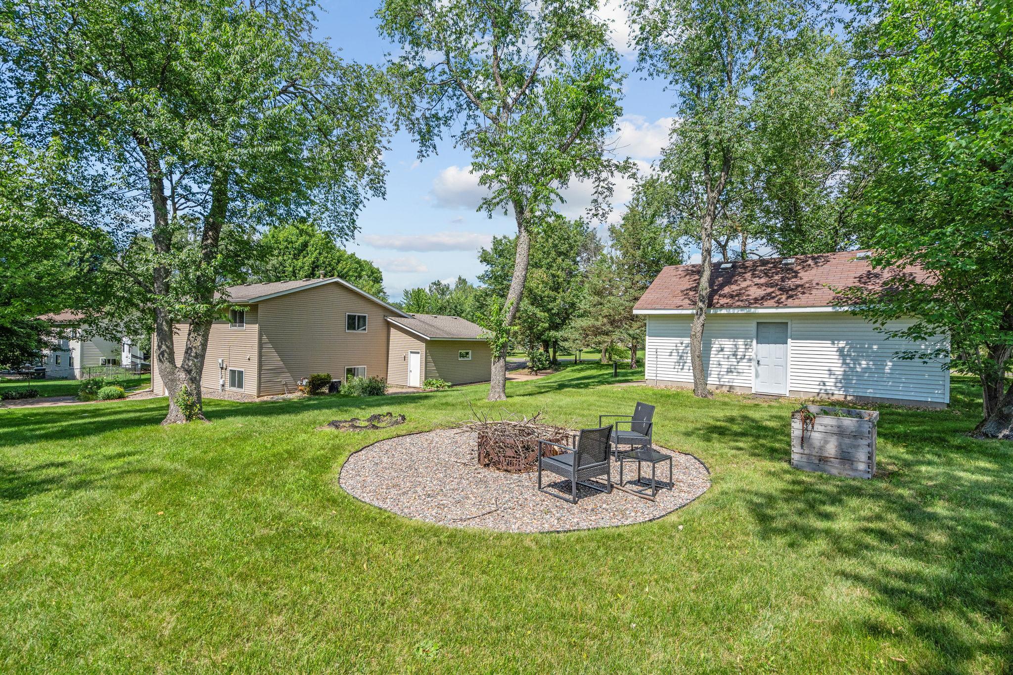Fire pit and detached garage in the side yard
