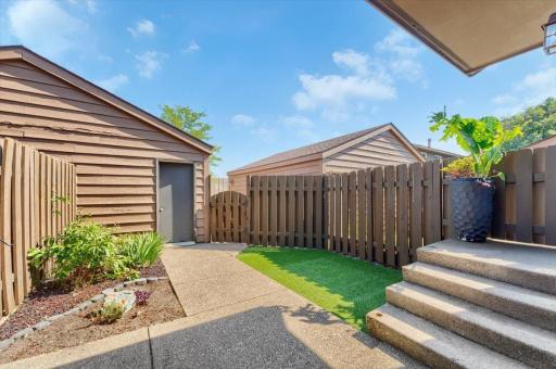 Private enclosed patio with tall wood privacy fence. A rare and desirable feature you won't find anywhere else!