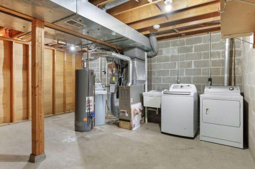 Rough-in for second Bathroom behind the water heater and water softener. Disclaimer: the gas water heater and washing machine have both been replaced